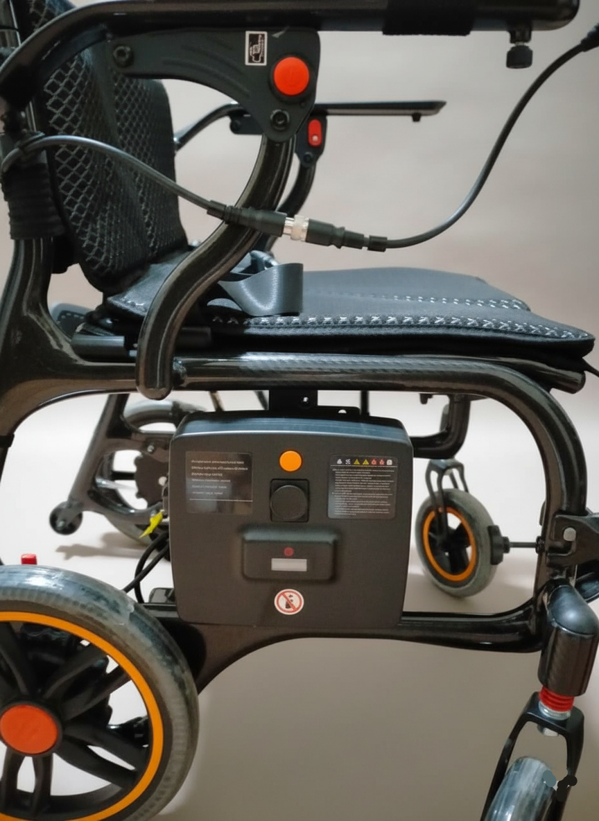 Close-up of a power wheelchair with visible components on a neutral background