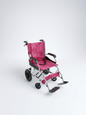 Pink folding wheelchair on a white background