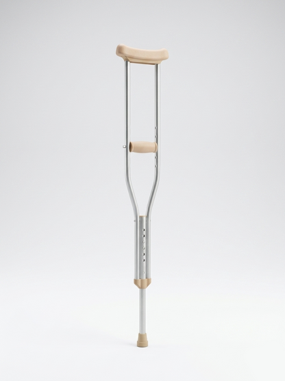 Crutch with wooden handle and footpad on a white background