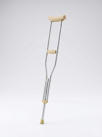 Crutch with beige grips on a light gray background
