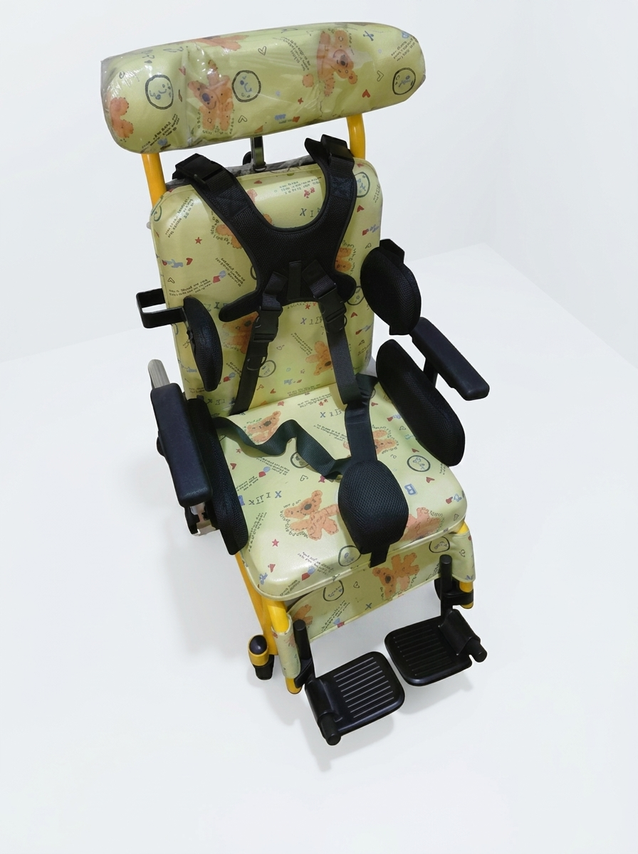 Children's seat with floral pattern and safety straps on a white background