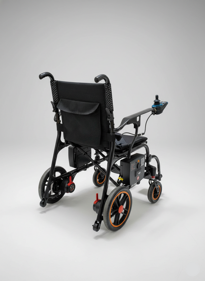 Black electric wheelchair on a gray background