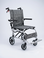 Compact folding wheelchair with gray patterned seat on a white background