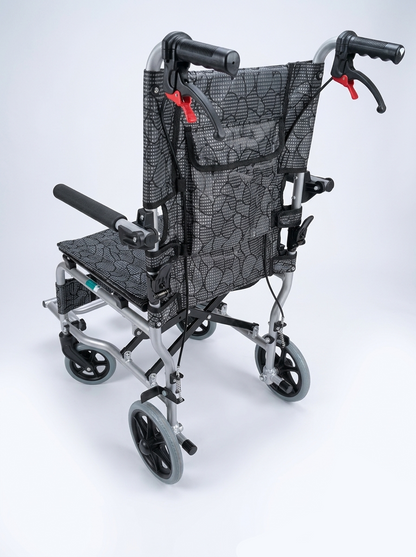 Foldable wheelchair with a black seat cover on a white background