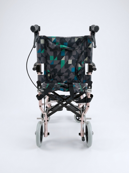 Foldable travel wheelchair with geometric pattern on a white background
