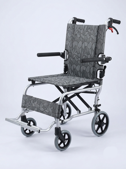 Foldable wheelchair with patterned seat and backrest on a light gray background